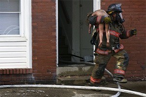 Child being rescued from a fire