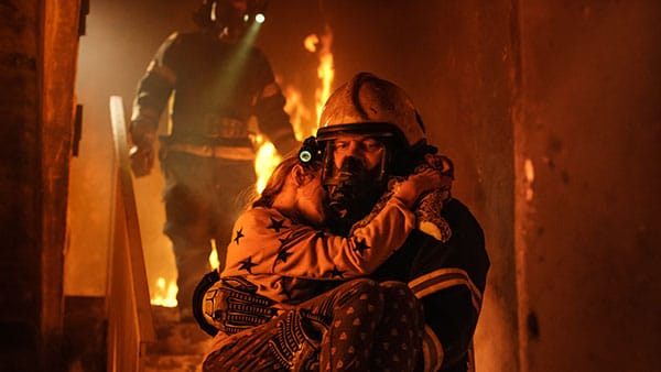 Fireman rescuing a child from a fire