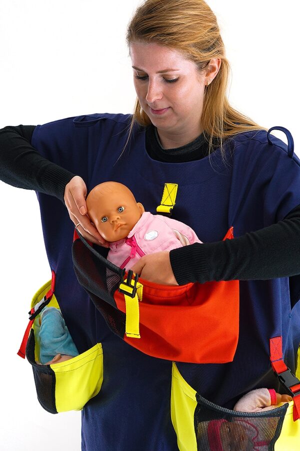 Carer placing baby into a Baby Mover Newborn